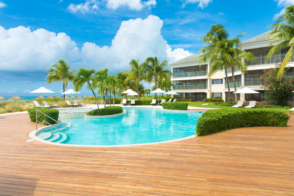 A view of the pool with suites in the background.
