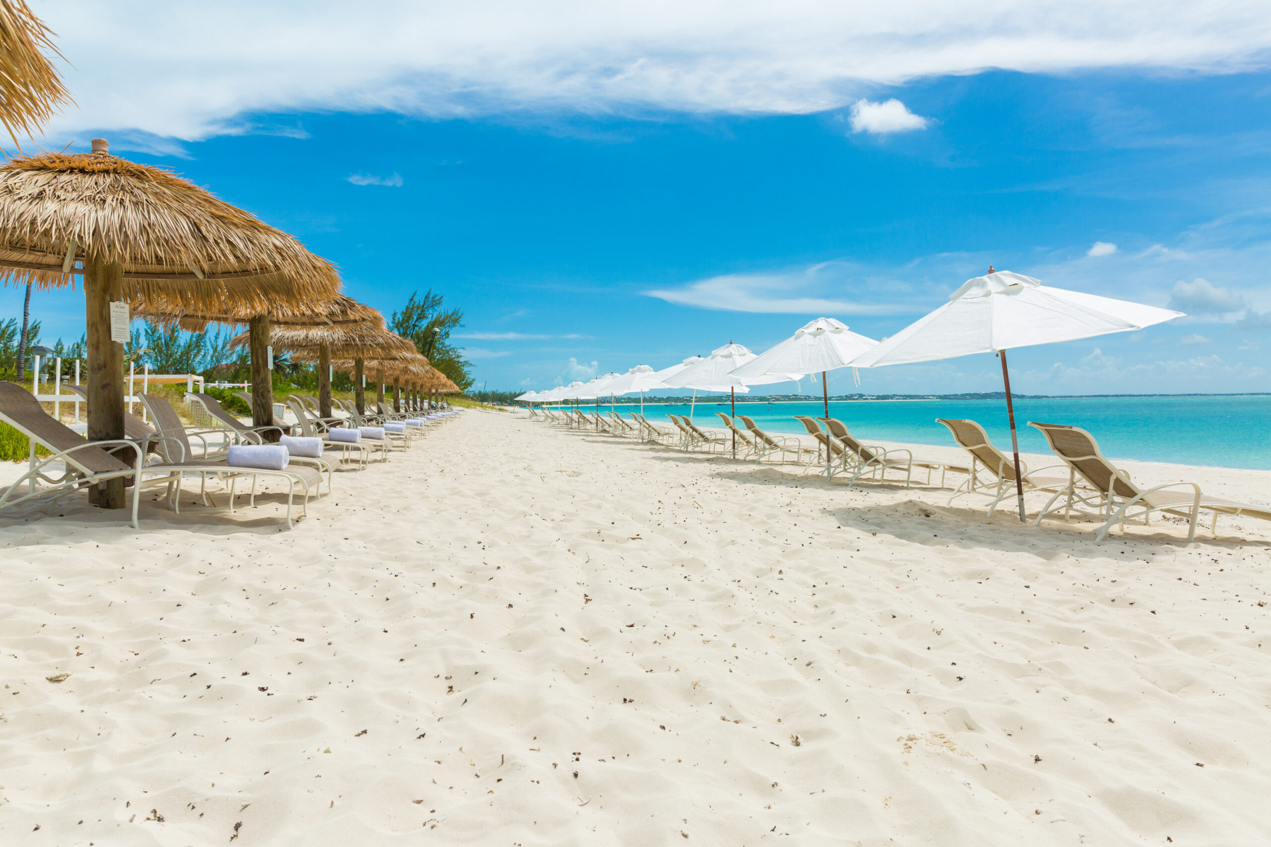 Sands Beach Aisle Between Palapas and Umbrellas