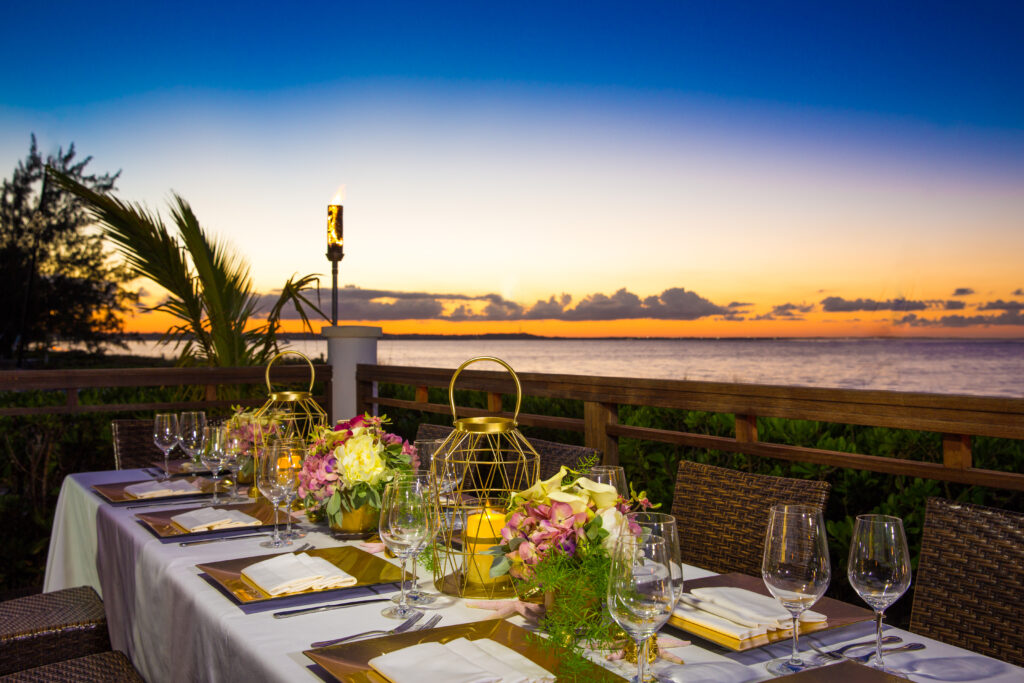 Dining table at Hemingway's Restaurant at sunset with ocean view
