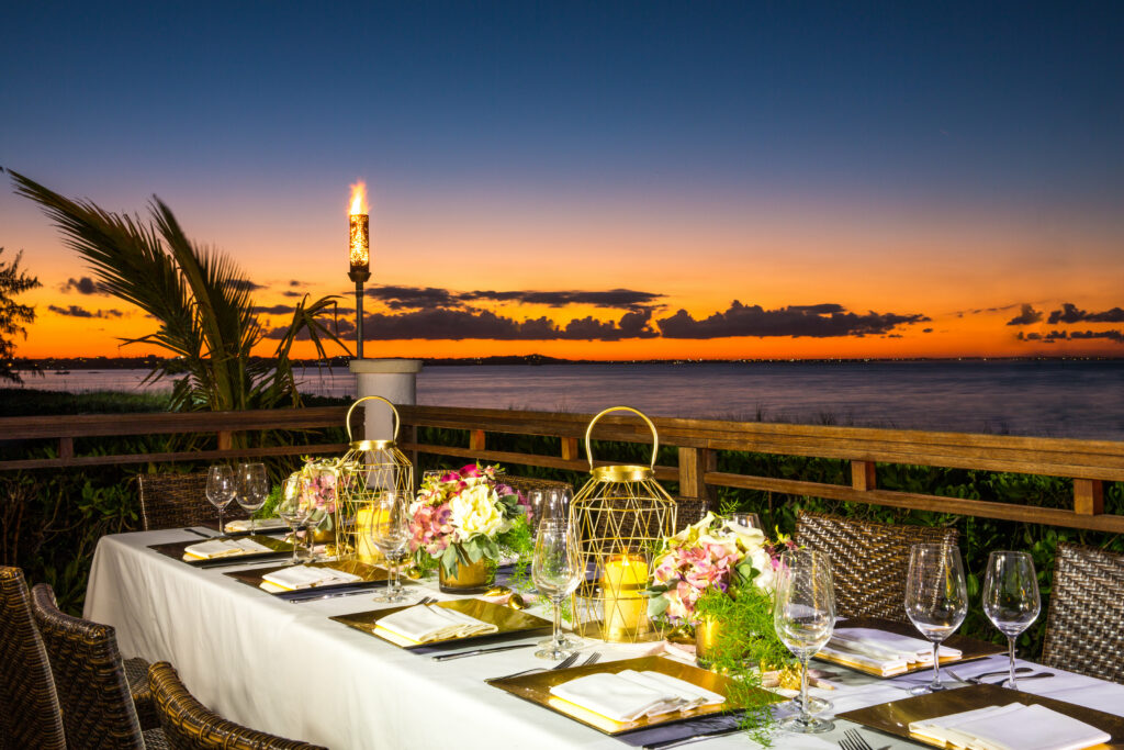Dining table at Hemingway's Restaurant at sunset with ocean view