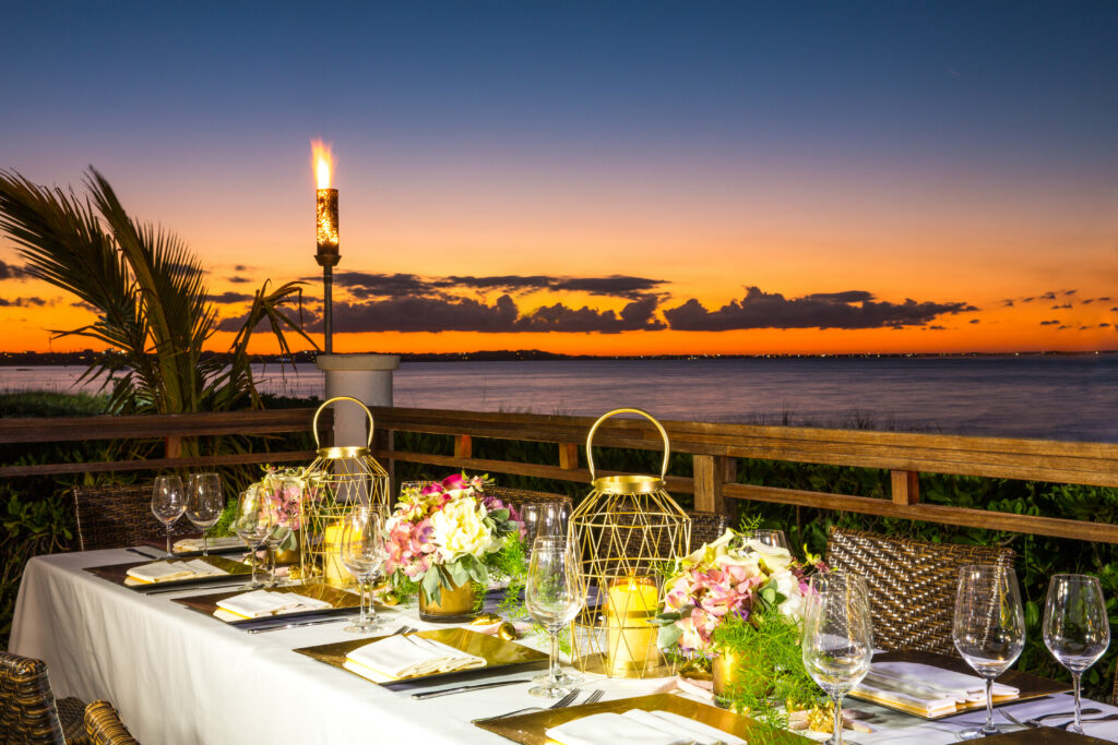 Dining table at Hemingway's Restaurant at sunset with ocean view