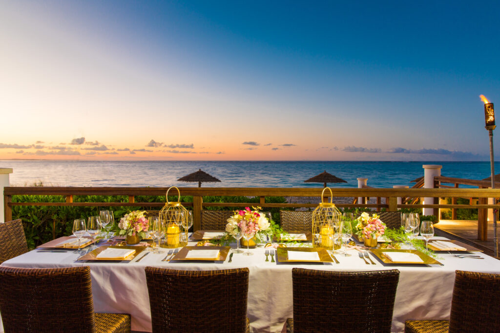 Dining table at Hemingway's Restaurant at sunset with ocean view