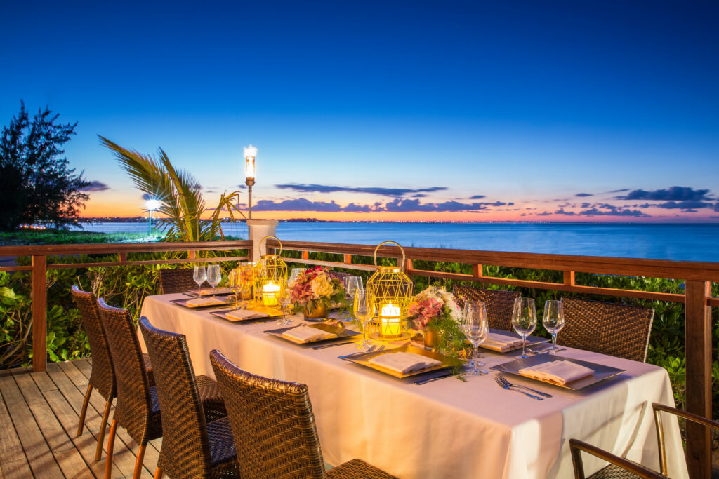 Dining table at Hemingway's Restaurant with ocean view at sunset
